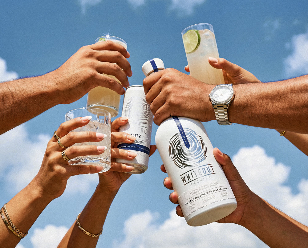 Friends cheering and celebrating with Whiteout tequila